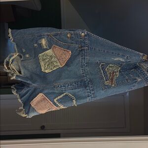 Blue Jean Shorts with Decorative Patches and Frayed Hem